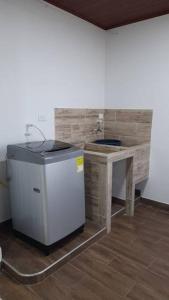 A kitchen or kitchenette at Apartahotel Zamflor