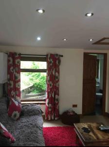 a bedroom with a bed and a window at The Croft Accommodation in Gamrie