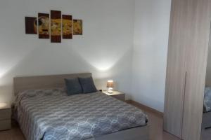Ένα ή περισσότερα κρεβάτια σε δωμάτιο στο Casa Lu Farnaru
