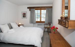 Letto o letti in una camera di Holiday flat Val di Lai with Jacuzzi for 6 persons-Lenzerheide
