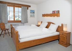 Letto o letti in una camera di Holiday flat Val di Lai with Jacuzzi for 6 persons-Lenzerheide
