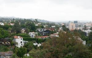 a view of a city with trees and buildings at Hollywood Hills Hotel in Los Angeles