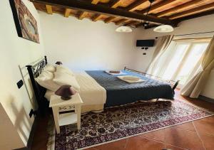 Postel nebo postele na pokoji v ubytování B&B Giardino delle Camelie