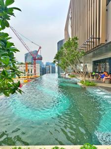a river in the middle of a city at Axon Residence By Perkasa Suites in Kuala Lumpur
