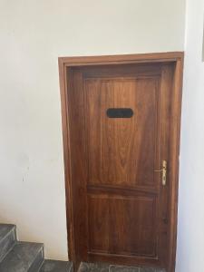 a wooden door in the corner of a room at Blue Villa Zanzibar in Pwani Mchangani