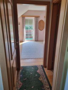 an open door to a room with a hallway with a rug at 2 Person Beedroom at Fam Herbst I Thaller in Wagerberg