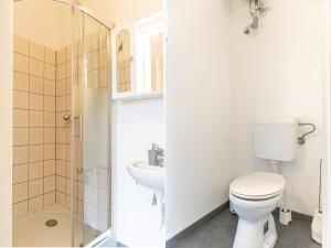 a bathroom with a toilet and a sink at Brilliant 1BR Apt Comfortable Design/Near Schönbrunn in Vienna