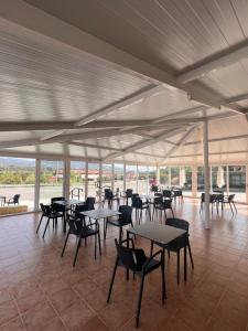 a large tent with tables and chairs in a room at Hostal mesón del cinca in El Grado