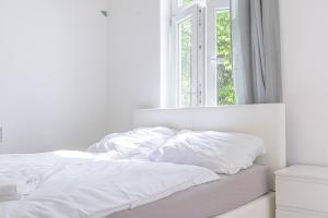 Astonishing 1BR Apt Easy Use Design/Near Schönbrunn客房内的一张或多张床位