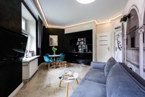 Televízia a/alebo spoločenská miestnosť v ubytovaní Apartament Marylin