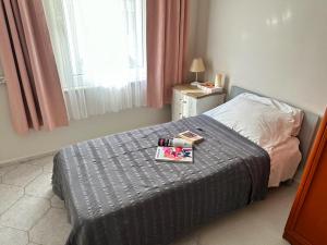 a bedroom with a bed with a tray on it at Merkeze Yakın, Ev Rahatlığında in Marmaris
