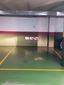 an empty parking garage with a basketball court at Piso Estación Termal II in Ourense