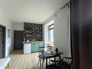 Kuchyňa alebo kuchynka v ubytovaní Apartmány Oxota