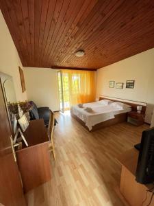 Postel nebo postele na pokoji v ubytování Apartman Mišo
