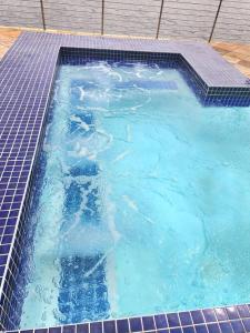 a large swimming pool with blue water in it at Modern 2Bedroom Self Catering unit HBos. in Mossel Bay