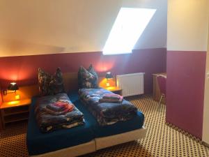 a room with a bed with pillows on it at Monteurzimmer Riesa in Riesa