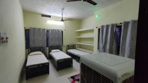 Katil atau katil-katil dalam bilik di JoyNest Guest House