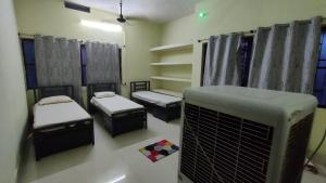 Katil atau katil-katil dalam bilik di JoyNest Guest House