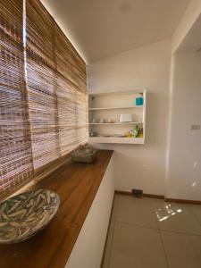 a room with a window with a wooden floor at Puerta 460 in Barraquero