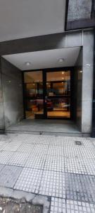 an entrance to a building with a large glass door at Billinghurst buenos aires in Buenos Aires