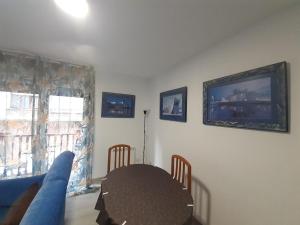 a living room with a table and a couch at BEC,CASA BARAKALDO al lado del BEC in Barakaldo