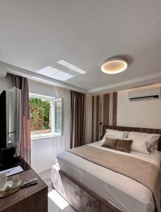 Postel nebo postele na pokoji v ubytování Luxury Rooms Andrea