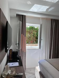 TV a/nebo společenská místnost v ubytování Luxury Rooms Andrea