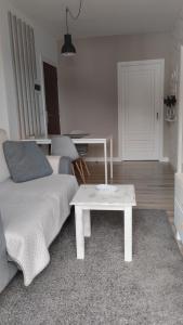 a living room with a couch and a coffee table at CASA LAXE DO BARRO in Cangas de Morrazo