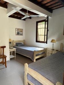 En eller flere senge i et værelse på La Casa de Pinamar