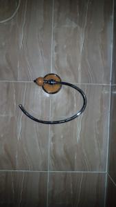 a wire on a tiled wall with a coil on it at Annex House For Rent in Manjai Kunda