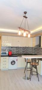 a kitchen with a table and a dining room at Apartment in Antalya Konyaaltı in Antalya