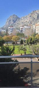 a view of a park with a mountain in the background at Apartment in Antalya Konyaaltı in Antalya