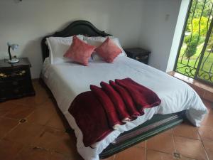 Postel nebo postele na pokoji v ubytování Cabañas & Glamping De Ruana Por Boyacá