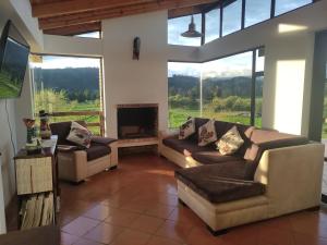 Posezení v ubytování Cabañas & Glamping De Ruana Por Boyacá
