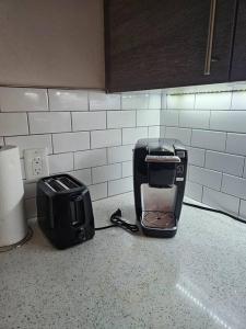 a toaster sitting on a counter in a kitchen at Midtown Atl Gem located 10 minutes from everything! in Atlanta