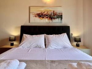 Postel nebo postele na pokoji v ubytování Villa Vassilis Fiscardo Kefalonia