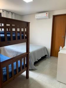 a bedroom with two bunk beds in a room at Villas de Bananeiras in Bananeiras