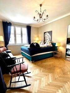 a bedroom with a bed with a statue of a woman at Center Apartment with 360° Rooftop in Vienna