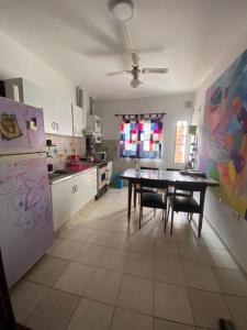 a kitchen with a table and a dining room at Espacio Planetaria in Córdoba +3 photos