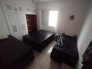 Ένα ή περισσότερα κρεβάτια σε δωμάτιο στο Apartamento em Praia Grande - Frente ao Mar