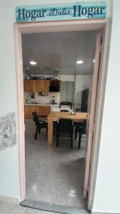 a kitchen and dining room with a table in a room at Apto Hogar Dulce Hogar ARBOLETES in Arboletes