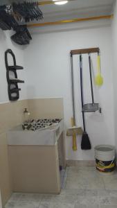 a kitchen with utensils hanging on a wall at Apto Hogar Dulce Hogar ARBOLETES in Arboletes