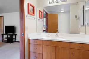 a bathroom with a sink and a mirror at 26 Mountain View Lodge - Meredith Lodging in Bend +29 photos