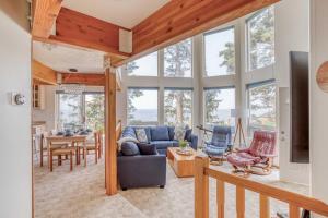 a living room with a couch and a table at Neskowin Lookout in Neskowin