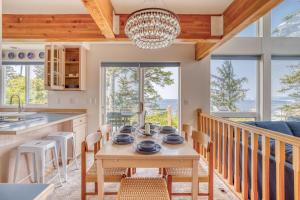 a kitchen and dining room with a table and chairs at Neskowin Lookout in Neskowin