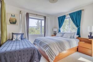 a bedroom with two beds and a window at Neskowin Lookout in Neskowin