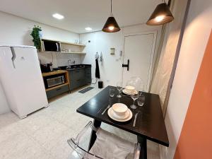 Η κουζίνα ή μικρή κουζίνα στο H02- Studio prático e moderno em ótima localização