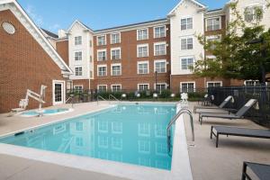 a swimming pool in front of a building at Residence Inn by Marriott Williamsburg in Williamsburg