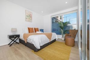 Postel nebo postele na pokoji v ubytování Oliver - The Hindmarsh Skyline Retreat + 10 fotografií