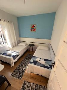 Cama ou camas em um quarto em Pousada Antares